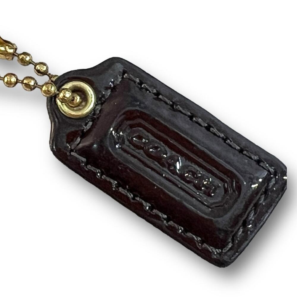 COACH WRISTLET in brown leather with Gold Tone hardware and COACH LOGO TAG - Picture 11 of 16
